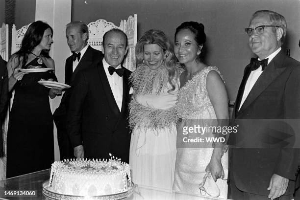 Jennifer Longoria , Bruno Pagliai , and Merle Oberon attend a party for the movie 'Interval' in Mexico City on the weekend of March 3-4, 1973.