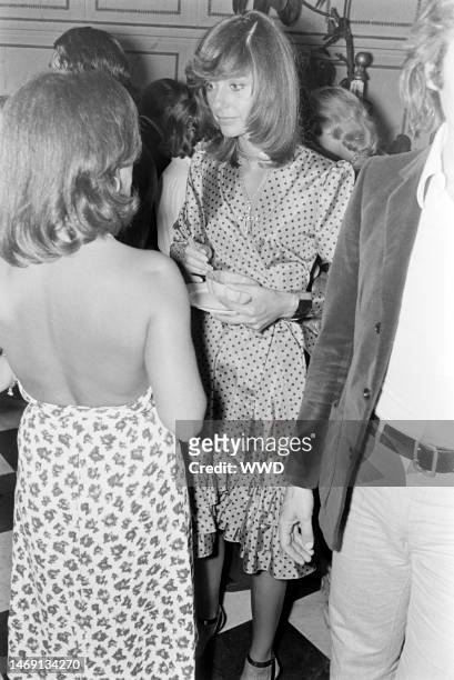 Mary Russell and guests mingle at Charlotte Aillaud's party for Yves Saint Laurent.