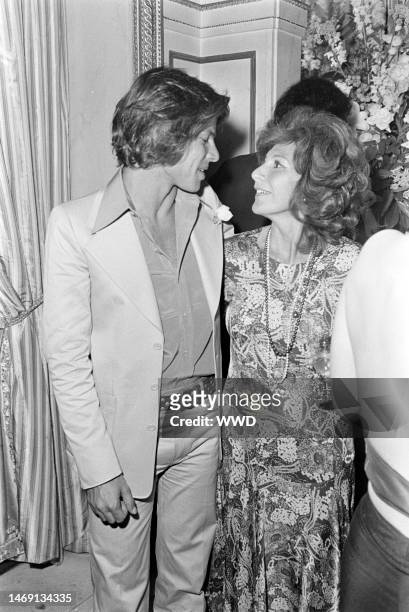 Hiram Keller speaks with Charlotte Aillaud at her party for Yves Saint Laurent.