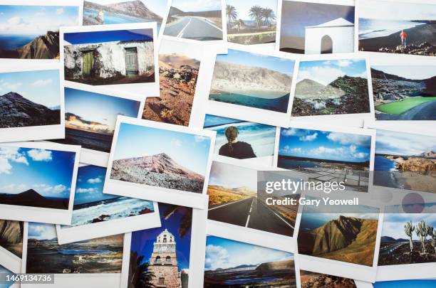 collection of instant film travel photos laid out on a table - photography fotografías e imágenes de stock