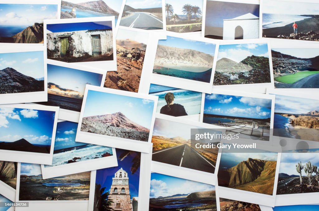 Collection of instant film travel photos laid out on a table