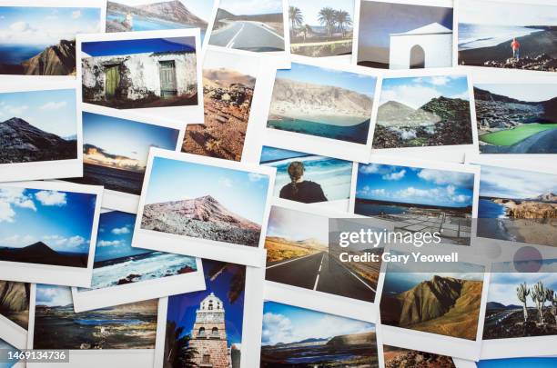 collection of instant film travel photos laid out on a table - temas fotográficos imagens e fotografias de stock