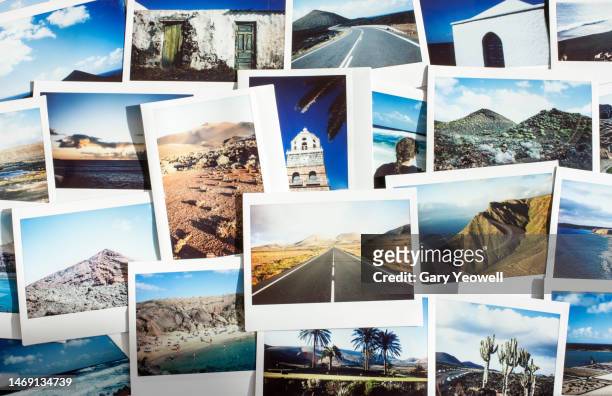 collection of instant film travel photos laid out on a table - photo collage imagens e fotografias de stock