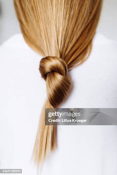 beautiful healthy long hair tied in a knot. - tail fin bildbanksfoton och bilder