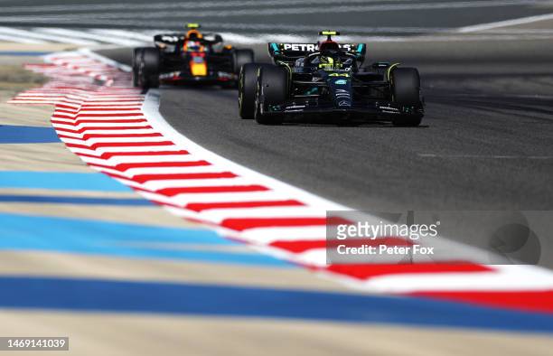 Lewis Hamilton of Great Britain driving the Mercedes AMG Petronas F1 Team W14 leads Sergio Perez of Mexico driving the Oracle Red Bull Racing RB19...