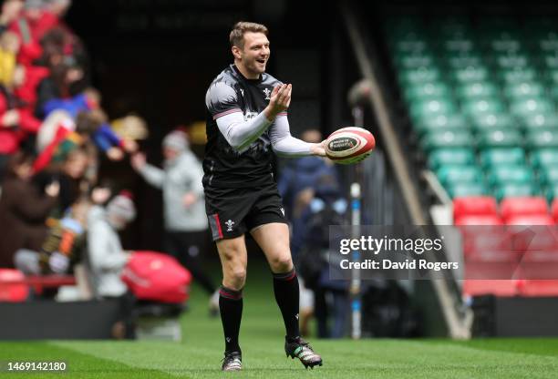 Dan Biggar of Wales passes the ball during the Wales Captain's Run at Principality Stadium on February 24, 2023 in Cardiff, Wales.