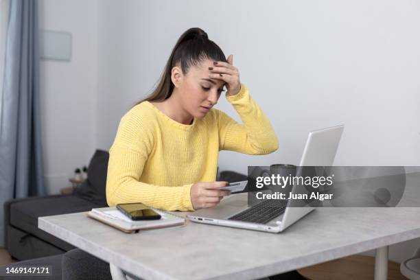 scared woman getting scammed during e commerce - victim stock pictures, royalty-free photos & images