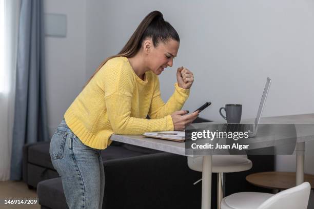angry woman communicating with scammers online - unexpected stock pictures, royalty-free photos & images