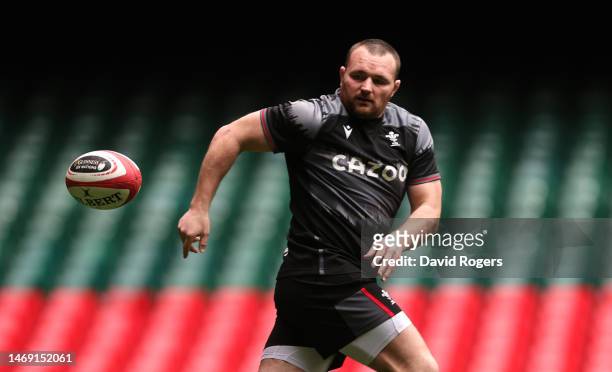 Ken Owens passes the ball during the Wales captain's run at the Principality Stadium on February 24, 2023 in Cardiff, Wales.
