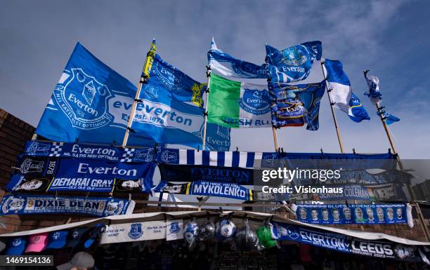 The Everton FC badge on flags and scarves outside Goodison Park ahead of the Premier League match between Everton FC and Leeds United at Goodison...