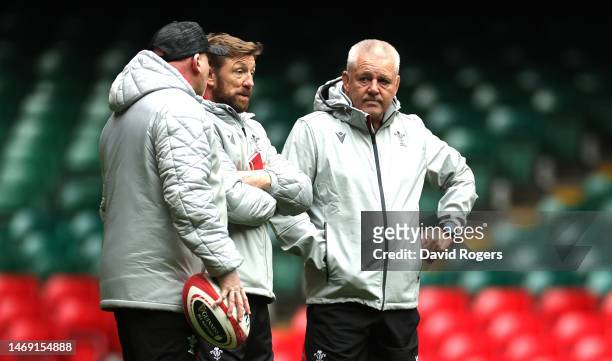 Neil Jenkins, the Wales kicking coach, Mike Forshaw, the Wales defence coach and Warren Gatland, the Wales head coach look on during the Wales...