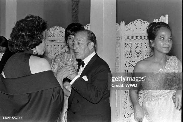Bruno Pagliai and Merle Oberon attend a party for the movie 'Interval' in Mexico City on the weekend of March 3-4, 1973.
