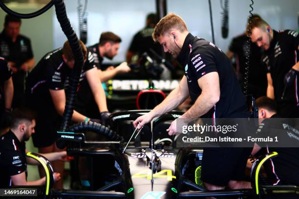 The Mercedes team work in the garage during day two of F1 Testing at Bahrain International Circuit on February 24, 2023 in Bahrain, Bahrain.