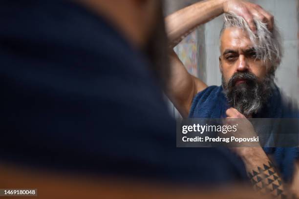 handsome man grooming in bathroom - mirror steam stockfoto's en -beelden