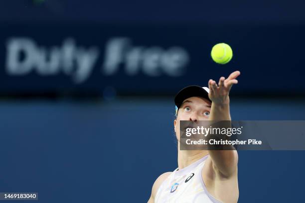 Iga Swiatek of Poland serves against Coco Gauff of the USA during her women's singles semi-final match on day six of the Dubai Duty Free Tennis at...