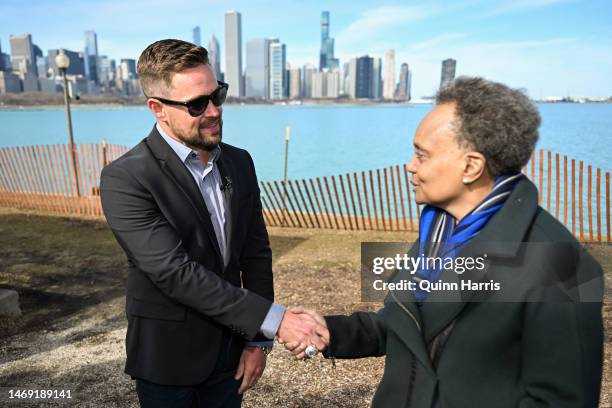 Cup Series driver, Ricky Stenhouse Jr., winner of the 65th Annual Daytona 500 and Chicago Mayor Lori Lightfoot shake hands on February 21, 2023 in...