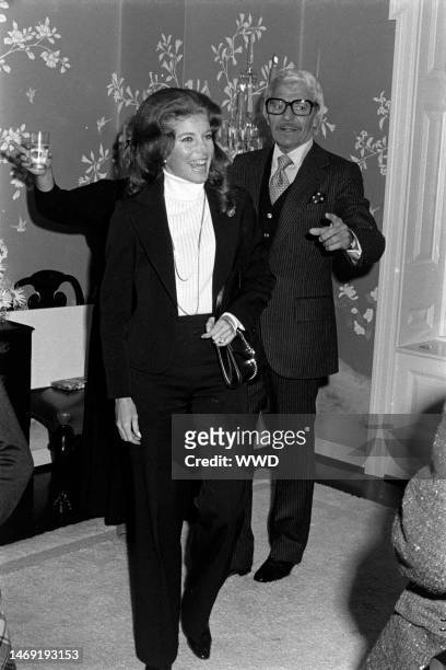 Niki Dantine and Greg Bautzer attend a party at the Los Angeles home of producer Ray Stark, celebrating Joanne Woodward's receipt of the New York...
