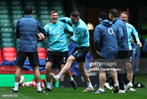 Owen Farrell, the England captain, celebrates with team mate Freddie Steward during the England captain's run at the Principality Stadium on February...