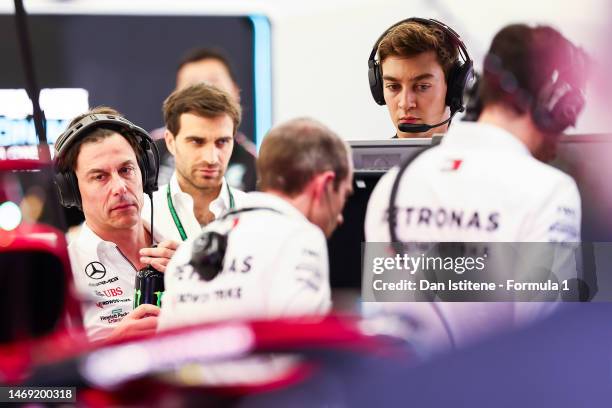 George Russell of Great Britain and Mercedes and Mercedes GP Executive Director Toto Wolff look on in the garage during day two of F1 Testing at...