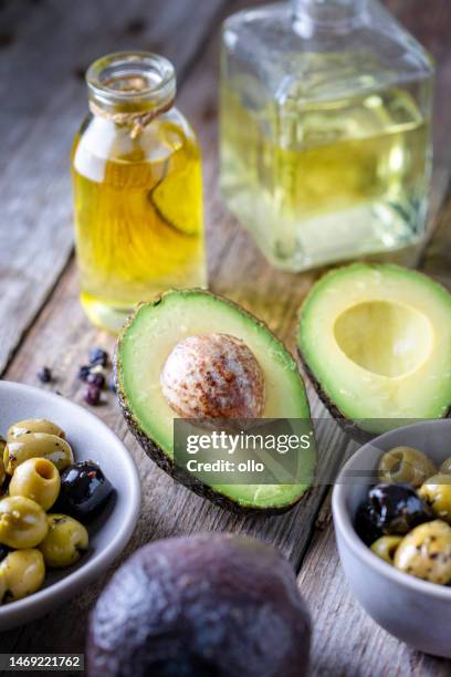 avocado, olives and oil - healthy fats stock pictures, royalty-free photos & images