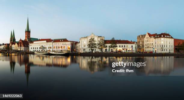 lübeck old town skyline near obertrave river (schleswig-holstein/ germany) - lübeck stock pictures, royalty-free photos & images