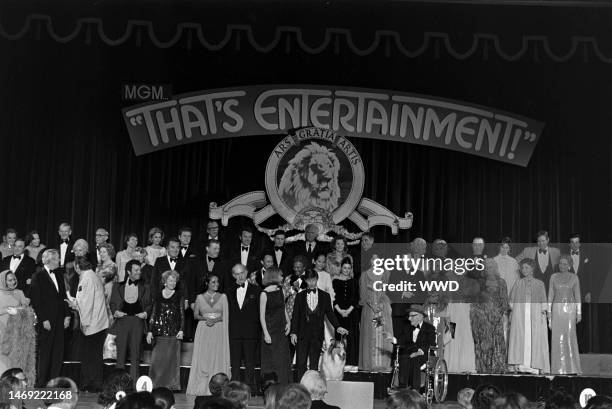 Movie stars including Gloria Swanson, James Stewart, Johnny Weissmuller, Russ Tamblyn, Elizabeth Taylor, Keenan Wynn, Shirley MacLaine, Roddy...