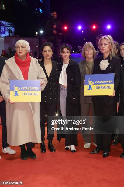 Claudia Roth, International Jury members Golshifteh Farahani, Kristen Stewart and Valeska Grisebach pose in a Demonstration of Solidarity with...
