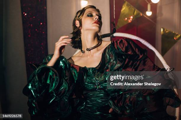 female portrait of beautiful woman at the performance show indoors, fashion style with light effects. circus and cabaret photography, vintage burlesque photo. - vintage burlesque stock pictures, royalty-free photos & images