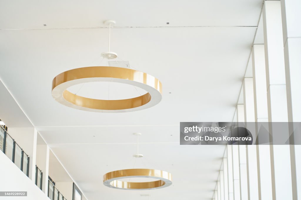 Round gold chandeliers on the ceiling