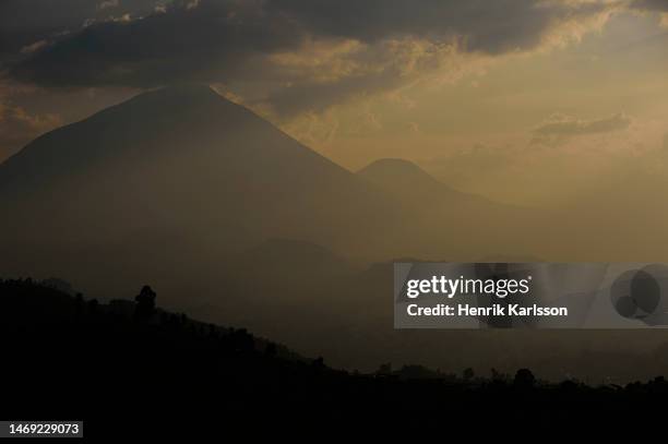 sunset at the virunga mountains - zaire stock pictures, royalty-free photos & images