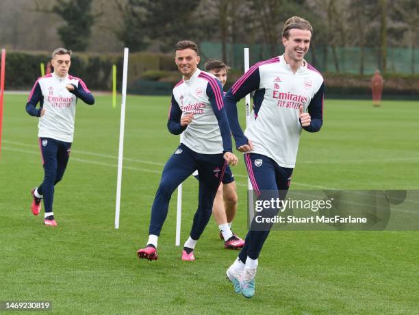 Ben White and Rob Holding of Arsenal during a training session at London Colney on February 24, 2023 in St Albans, England.