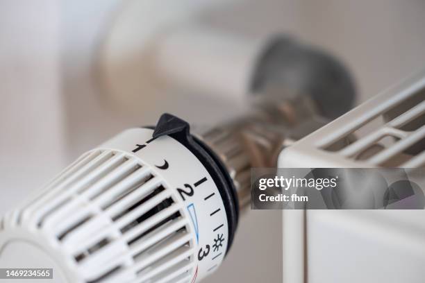 thermostat on a heater - heating home stock pictures, royalty-free photos & images