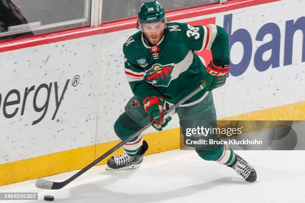 Ryan Hartman of the Minnesota Wild handles the puck against the Nashville Predators during the game at the Xcel Energy Center on February 19, 2023 in...