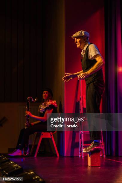 small group of actors on stage during the performance - theater industry stock pictures, royalty-free photos & images