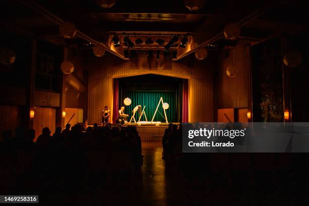 small group of actors on stage during their performance - peça de teatro escolar imagens e fotografias de stock