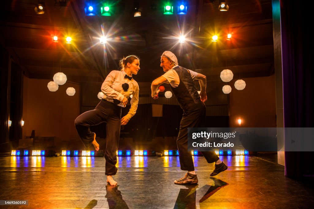 Two actors performing on stage
