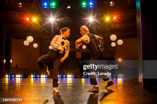 Two actors performing on stage Two actors performing on stage