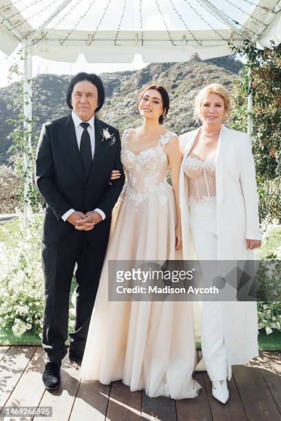 Gene Simmons, Sophie Tweed-Simmons and Shannon Tweed-Simmons pose for a wedding portrait at a private residence on February 22, 2023 in Malibu,...