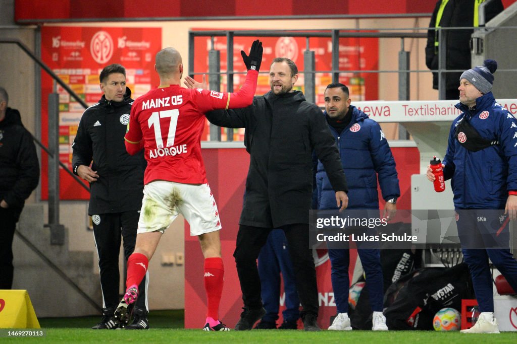 Ludovic Ajorque of 1.FSV Mainz 05 celebrates with Bo Svensson, Head ...