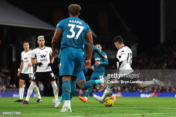 Manor Solomon of Fulham scores the team's first goal during the Premier League match between Fulham FC and Wolverhampton Wanderers at Craven Cottage...