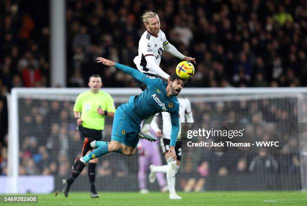 Diego Costa of Wolverhampton Wanderers battles for possession with Tim Ream of Fulham during the Premier League match between Fulham FC and...