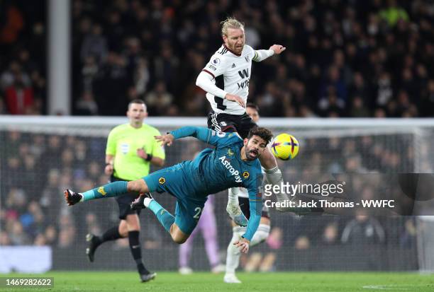 Diego Costa of Wolverhampton Wanderers battles for possession with Tim Ream of Fulham during the Premier League match between Fulham FC and...