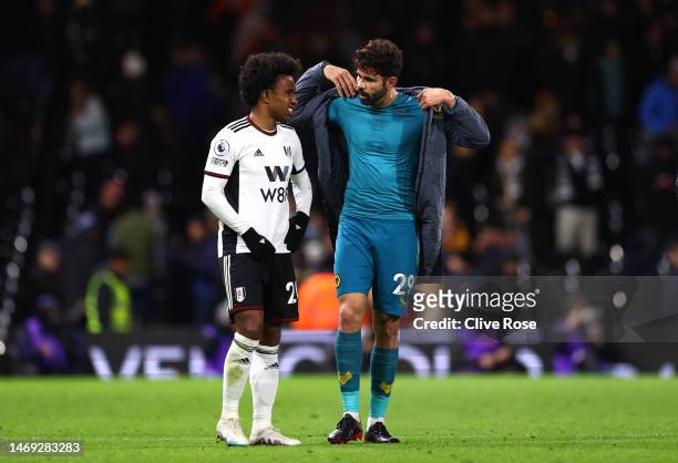 Diego Costa of Wolverhampton Wanderers speaks to Willian of Fulham following the team's draw in the Premier League match between Fulham FC and...