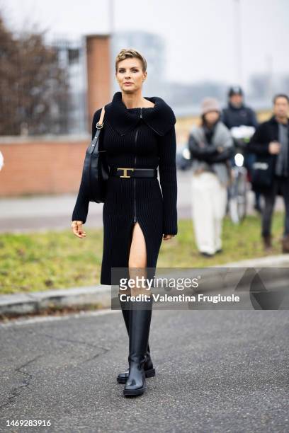 Martina Colombari is seen wearing a ribbed black dress outside the Tod's show during the Milan Fashion Week Womenswear Fall/Winter 2023/2024 on...