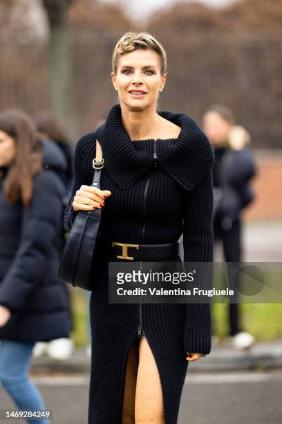 Martina Colombari is seen wearing a ribbed black dress outside the Tod's show during the Milan Fashion Week Womenswear Fall/Winter 2023/2024 on...