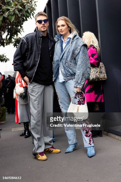 Laurens van Leeuwen is seen wearing a leather jacket and adidas pants, Romee Strijd is seen wearing outside the Gucci show during the Milan Fashion...