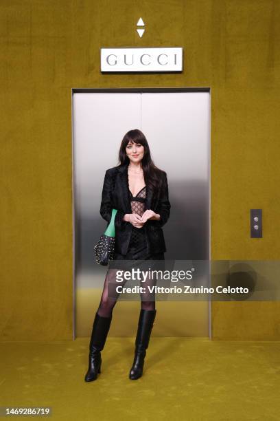 Dakota Johnson arrives at the Gucci show during Milan Fashion Week Fall/Winter 2023/24 on February 24, 2023 in Milan, Italy.