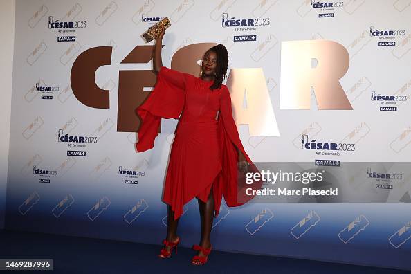 Alice Diop poses with the "Best first film" César a during the 48th