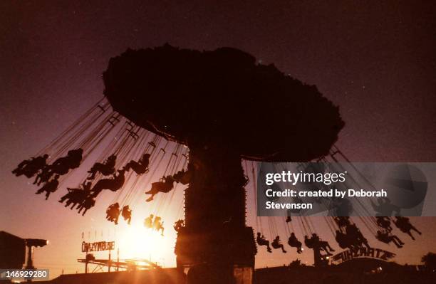 fair swings at sunset - columbia stock-fotos und bilder