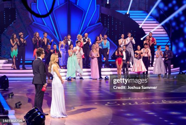 Hosts Victoria Swarovski and Daniel Hartwich on stage with contestants during the first "Let's Dance" show at MMC Studios on February 24, 2023 in...